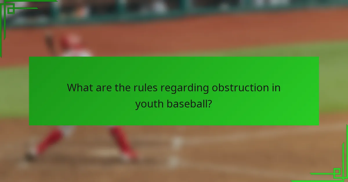 What are the rules regarding obstruction in youth baseball?