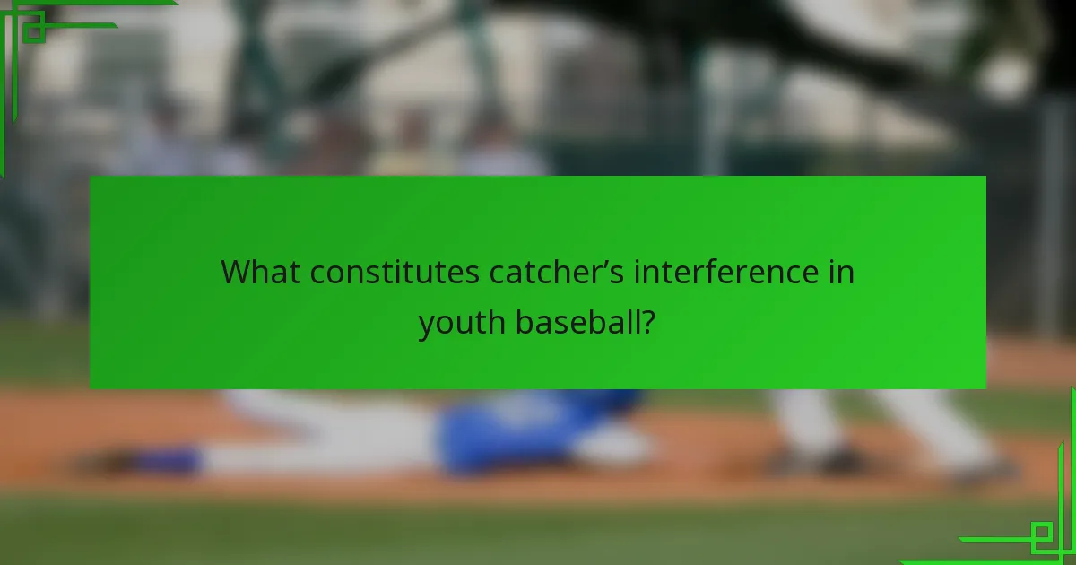 What constitutes catcher’s interference in youth baseball?